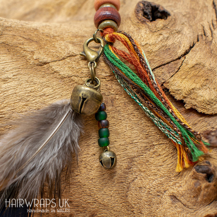 Bell and Green Bead Feather Dangle Charm.